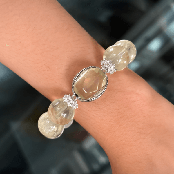 Yellow Azeztulite crystal bead bracelet on wrist