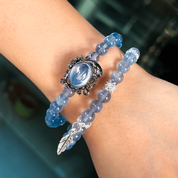 Blue Crystal Bead Bracelet with Black Vintage Charm and Leaf Pendant