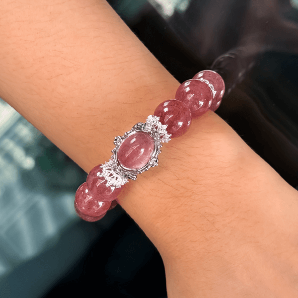 Strawberry Quartz Crystal Bead Bracelet with intricate silver centerpiece