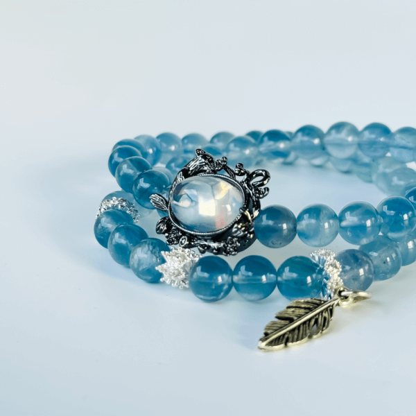 Blue Crystal Bracelet with Silver Leaf Pendant and Black Charm