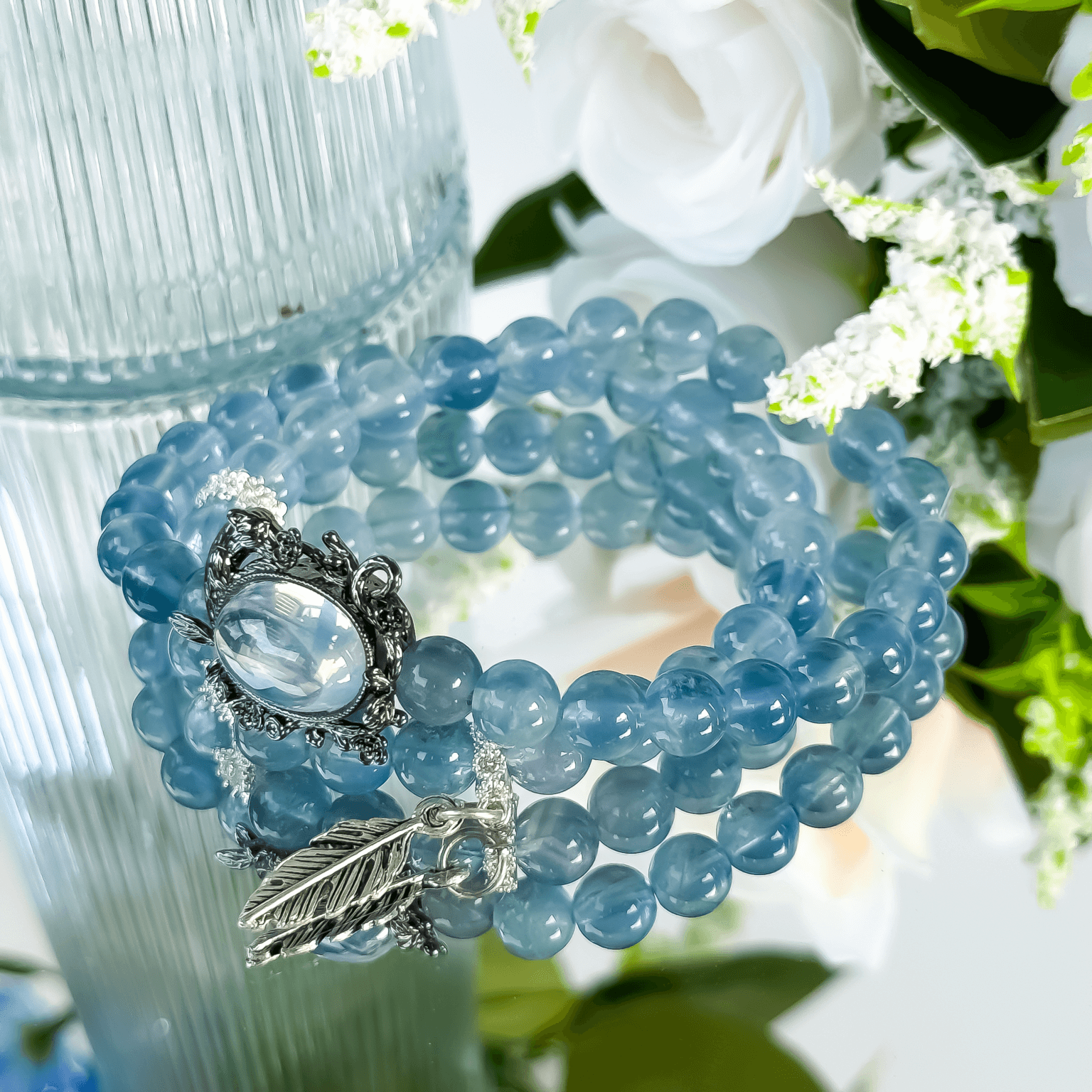 Blue Crystal Bead Bracelet with Black Vintage Charm and Leaf Pendant