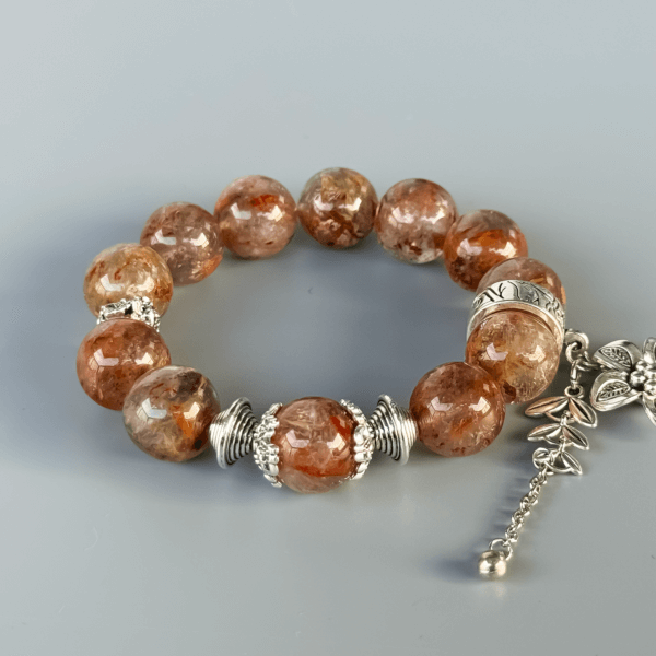 handmade ghost crystal bracelet with floral silver charm
