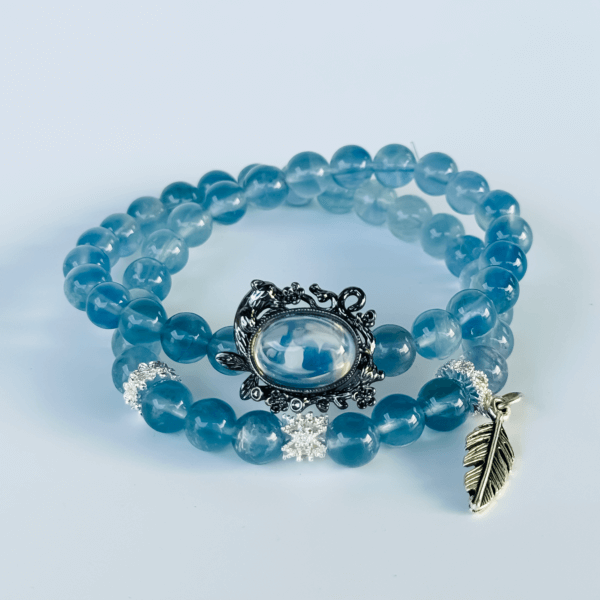 Blue Crystal Bracelet with Silver Leaf Pendant and Black Charm
