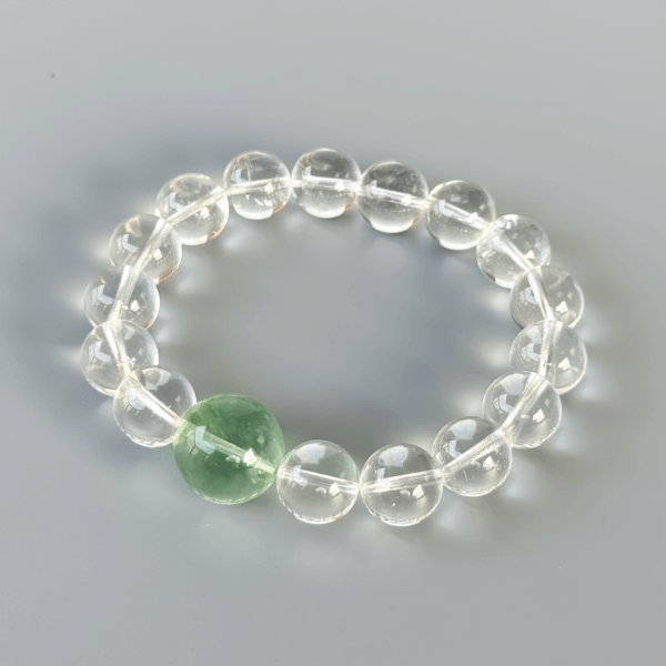 Clear Quartz bracelet with green crystal bead centerpiece
