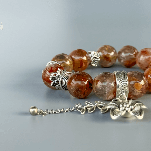 handmade ghost crystal bracelet with floral silver charm