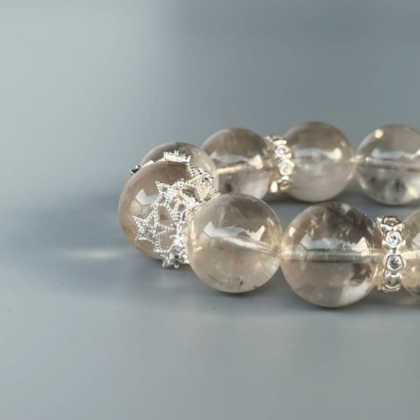 Close-up of Gray Rabbit Hair crystal bracelet beads with silver accents