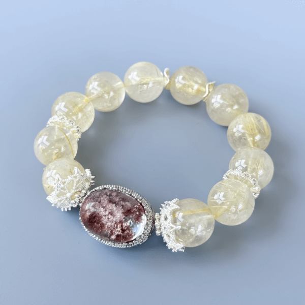 Golden Rutilated Quartz bracelet with a central stone detail.