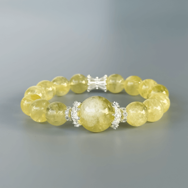 Luxurious yellow crystal bracelet on a grey background