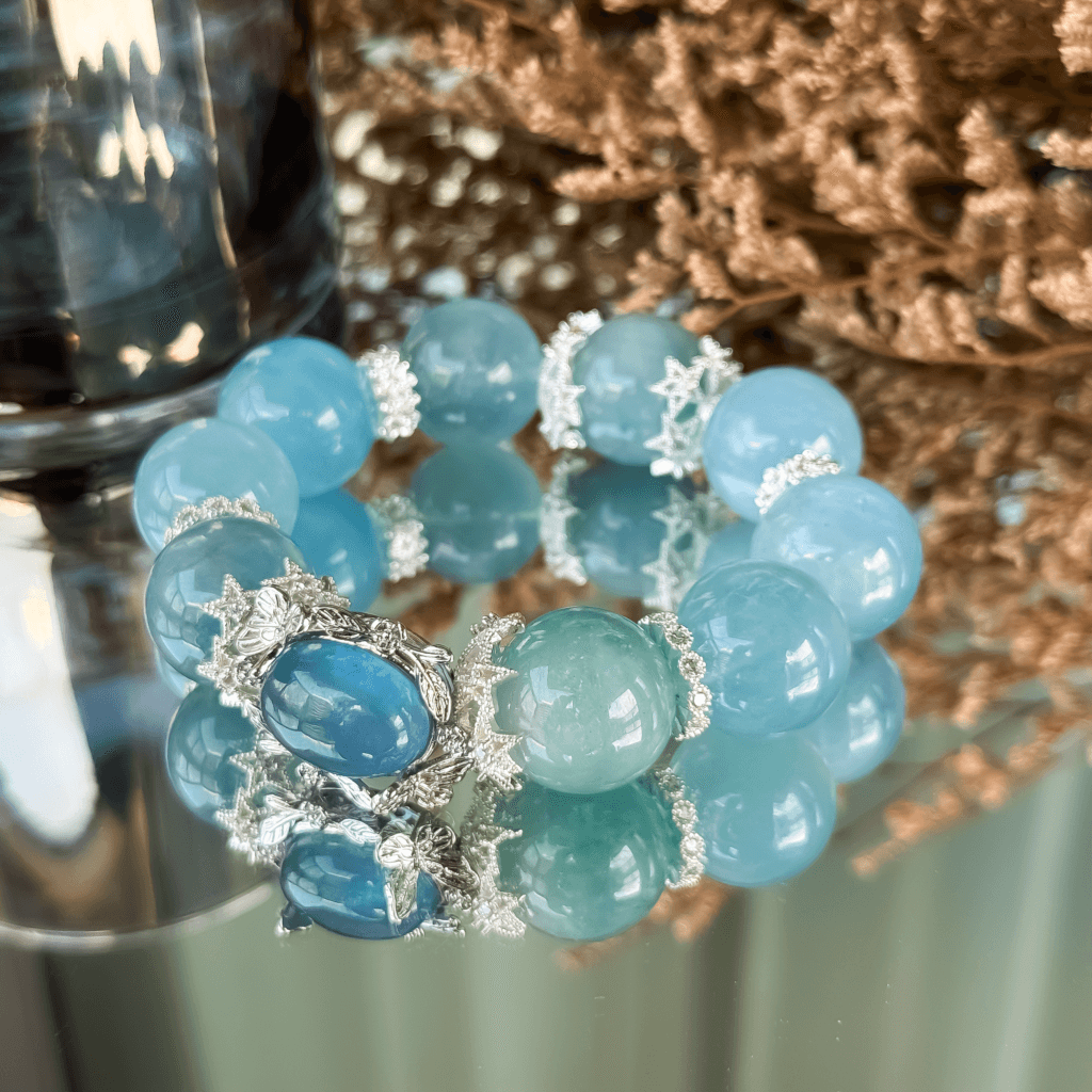 Reflective aquamarine bead bracelet with silver accents