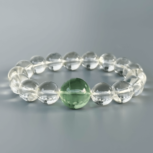 Clear Quartz bracelet with green crystal bead centerpiece