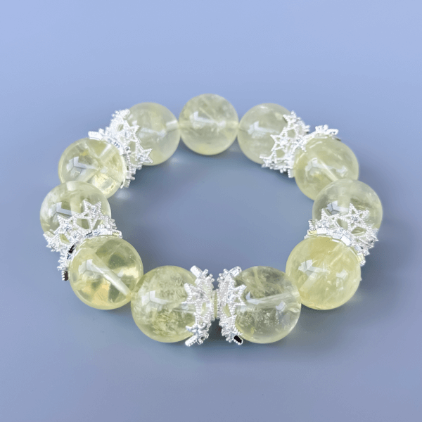 Yellow crystal bead bracelet with silver crown spacers