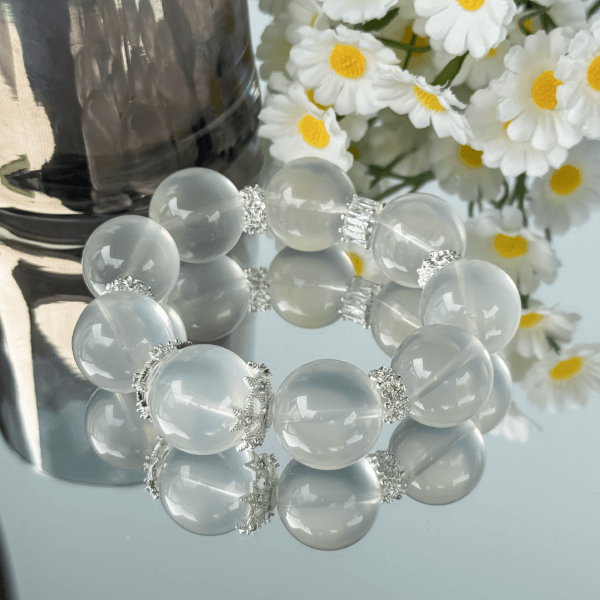 Clear Crystal Bead Bracelet with Reflections and Floral Background