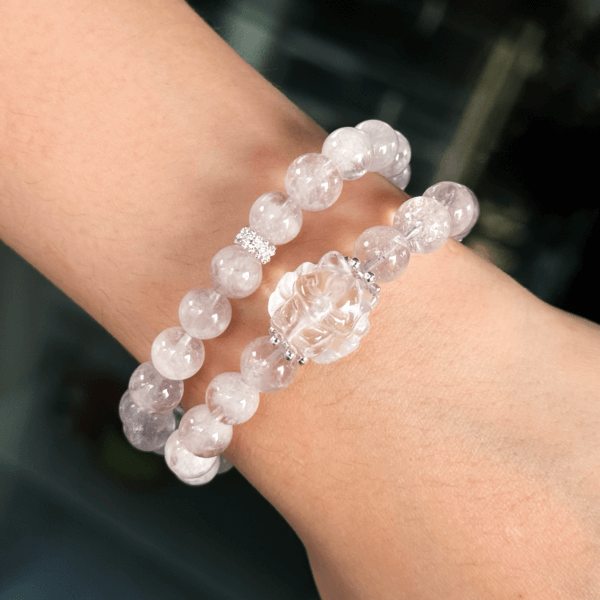Pink crystal bead bracelet with elegant silver accents on wrist