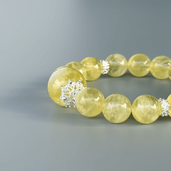 Luxurious yellow crystal bracelet on a grey background