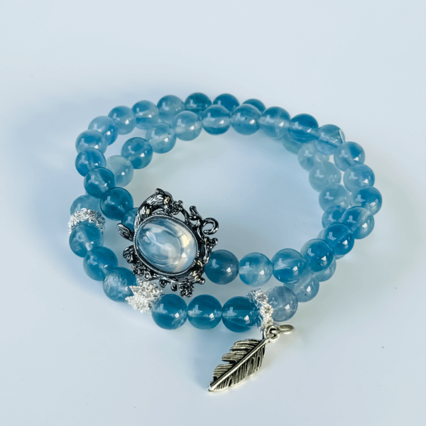 Blue Crystal Bracelet with Silver Leaf Pendant and Black Charm