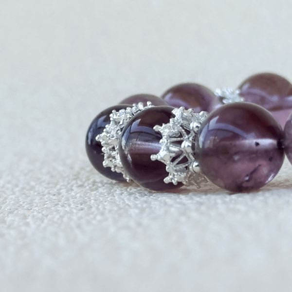 Lavender Amethyst crystal bracelet displayed flat