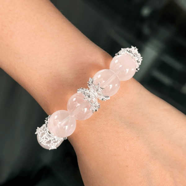 Elegant rose quartz crystal bracelet worn on wrist