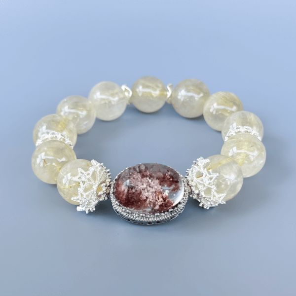 Golden Rutilated Quartz bracelet with a central stone detail.