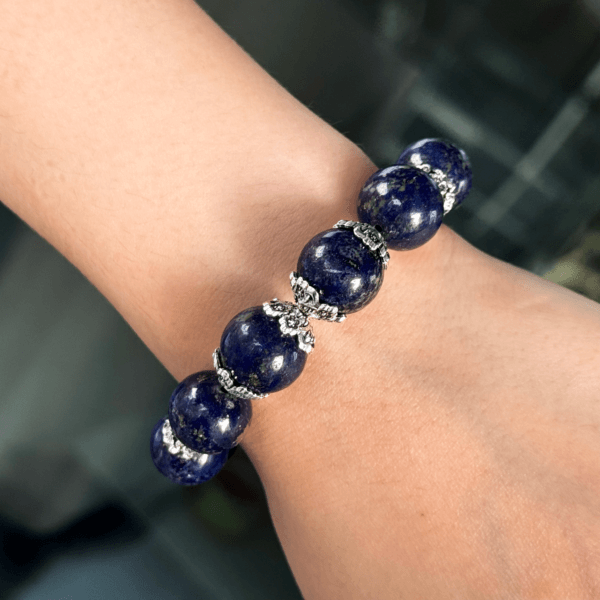 Lapis Lazuli Crystal Bracelet on Wrist with Silver Accent Pieces