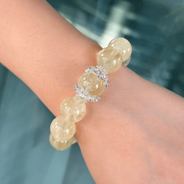 Yellow Azeztulite crystal bead bracelet on wrist