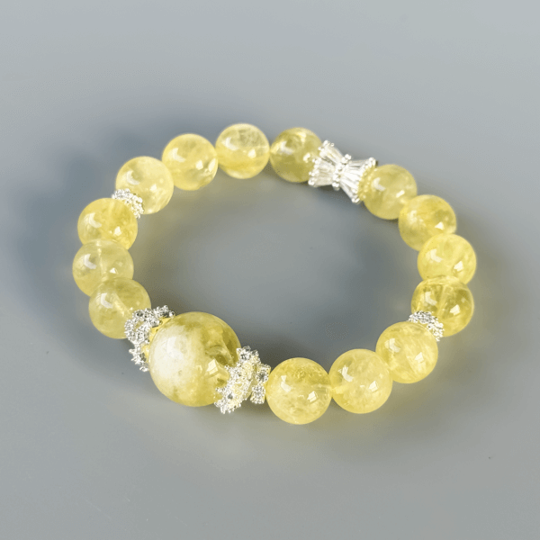 Luxurious yellow crystal bracelet on a grey background