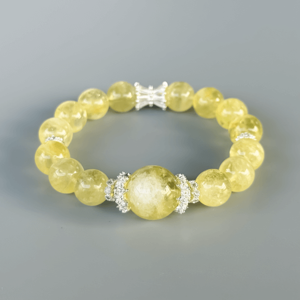 Luxurious yellow crystal bracelet on a grey background