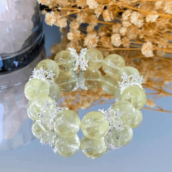 Yellow gemstone bead bracelet with reflective background