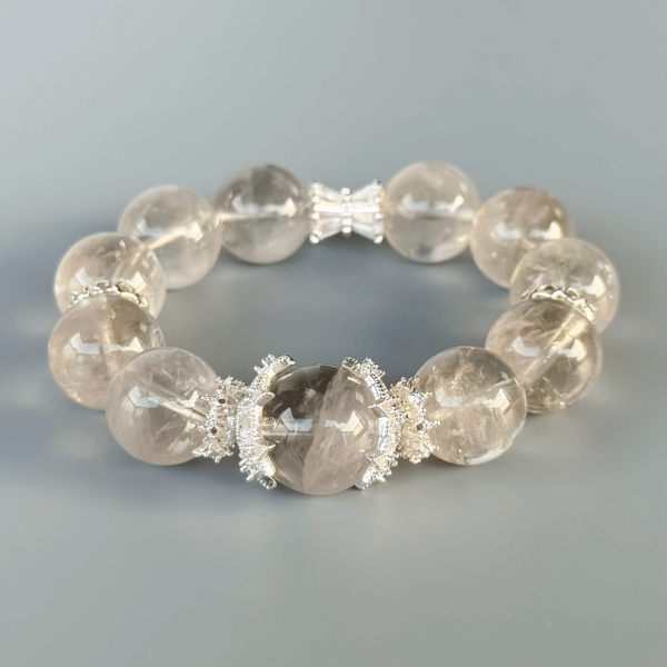 Close-up of Gray Rabbit Hair crystal bracelet beads with silver accents
