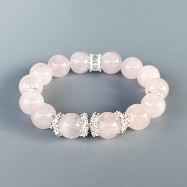 Rose quartz bracelet with silver accents close-up view