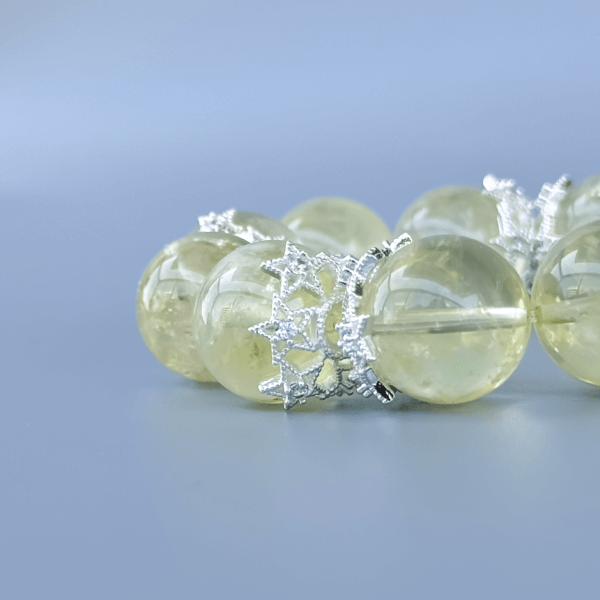 Yellow crystal bead bracelet with silver crown spacers
