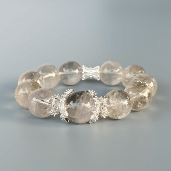 Close-up of Gray Rabbit Hair crystal bracelet beads with silver accents