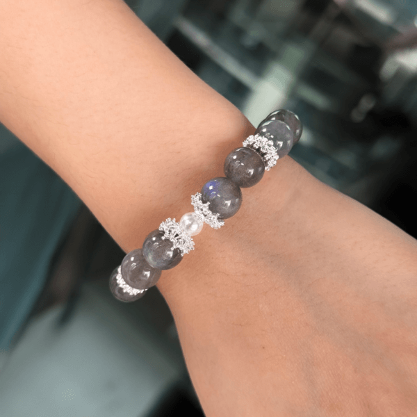 Labradorite crystal bracelet worn on wrist.