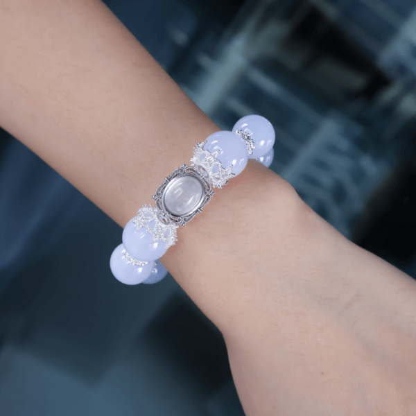 Aquamarine crystal bead bracelet on wrist with silver accents