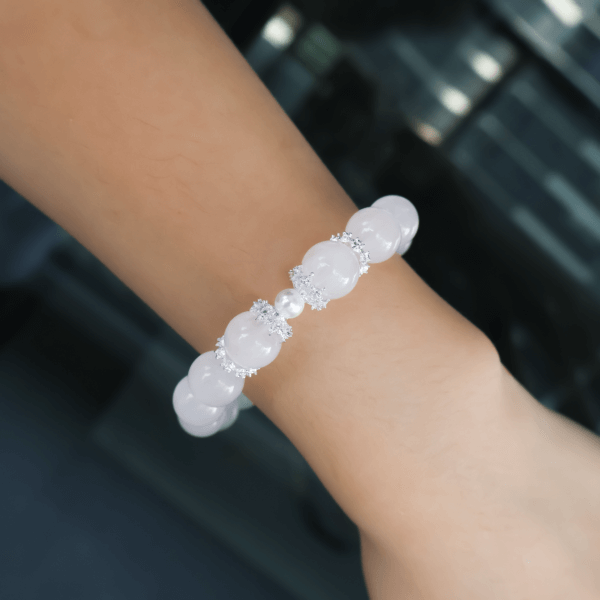 Grapefruit Rose Quartz Bracelet Worn on Wrist with Elegant Crystal and Pearl Beads