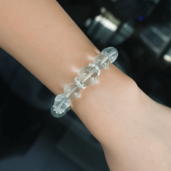 Green Fluorite bracelet worn on wrist for size reference.