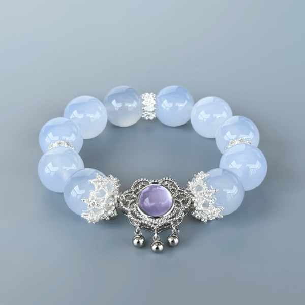 Blue Chalcedony crystal bracelet with a purple pendant and silver spacers