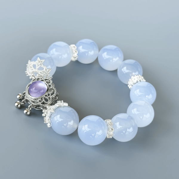 Blue Chalcedony crystal bracelet with a purple pendant and silver spacers