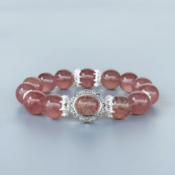Strawberry Quartz Beaded Bracelet Displayed on Minimal Background