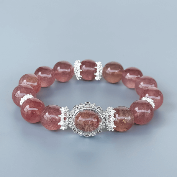 Strawberry Quartz Beaded Bracelet Displayed on Minimal Background