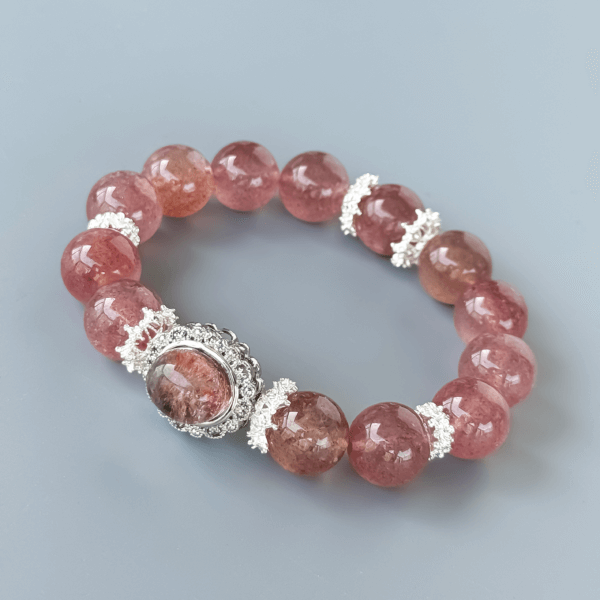 Strawberry Quartz Beaded Bracelet Displayed on Minimal Background