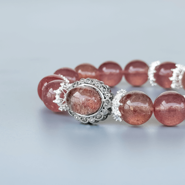 Strawberry Quartz Beaded Bracelet Displayed on Minimal Background