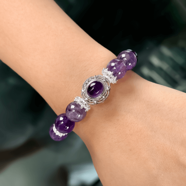 Icy Amethyst crystal bracelet on wrist with silver centerpiece