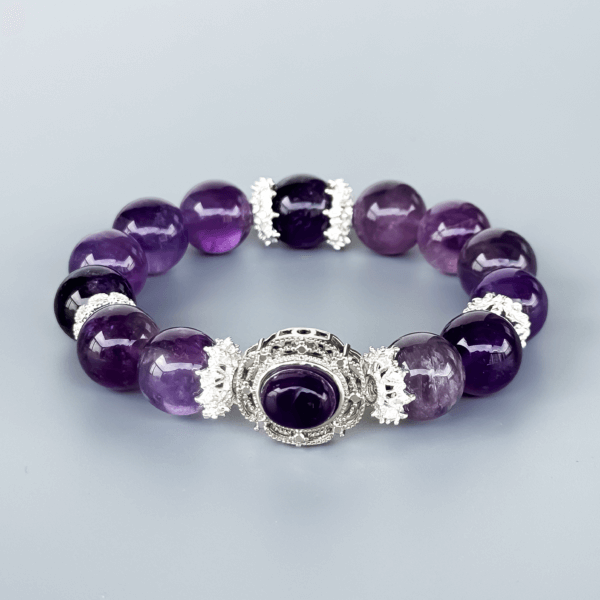 Icy Amethyst crystal bead bracelet with silver detailing on a neutral background