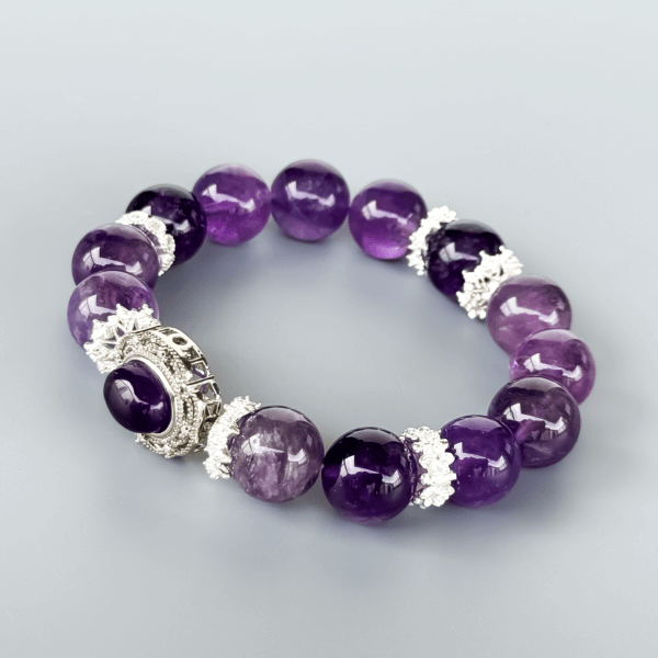 Icy Amethyst crystal bead bracelet with silver detailing on a neutral background