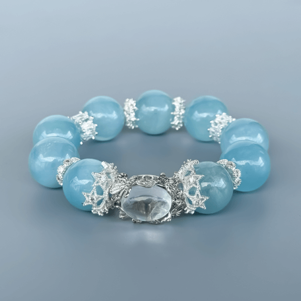 Aquamarine Crystal Bead Bracelet with Silver Accents on Display