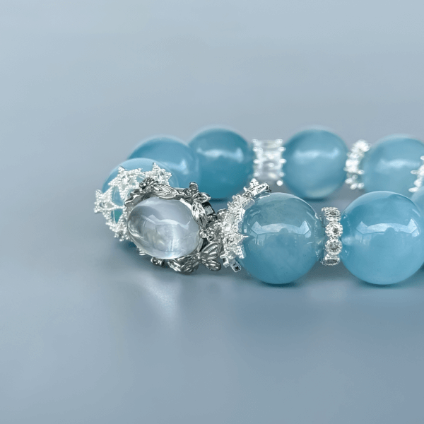 Aquamarine Crystal Bead Bracelet with Silver Accents on Display
