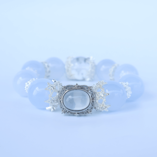 Close-up of Aquamarine crystal bead bracelet with silver centerpiece
