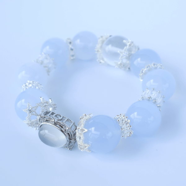 Close-up of Aquamarine crystal bead bracelet with silver centerpiece