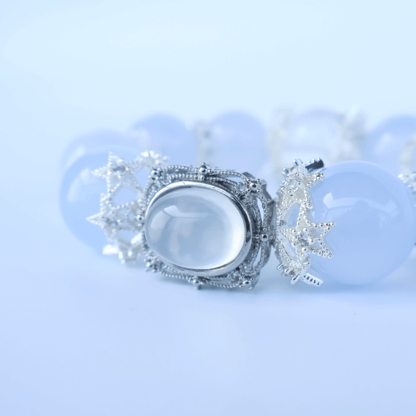 Close-up of Aquamarine crystal bead bracelet with silver centerpiece