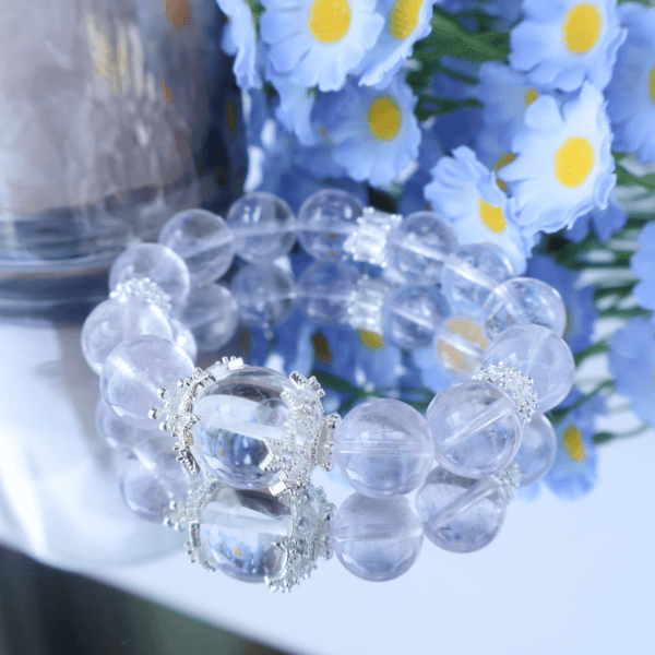 Bolivian Amethyst Crystal Bracelet displayed with flowers